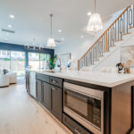 the interior of a Mazzarino Con & Dev home with modern amenities and a large kitchen island